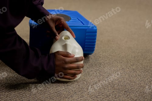 Preview: Closeup shot of a man practicing cardiopulmonary resuscitation (CPR)