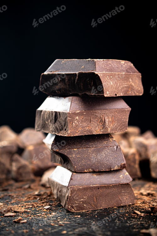 Preview: Pieces of dark chocolate on the table.