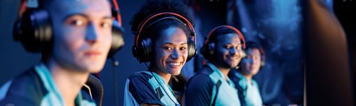 Preview: Young professional esports players playing games in internet cafe