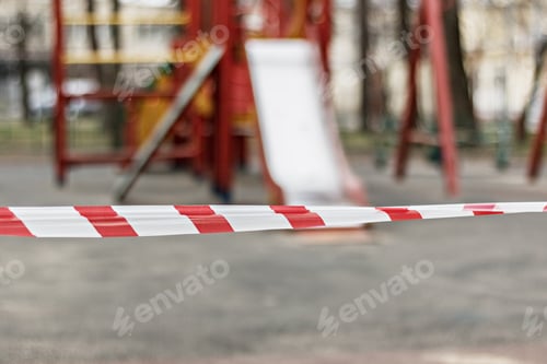 Preview: Closed playground during quarantine 2020. warning tape pulled around. Covid-19 Coronavirus Pandemic.