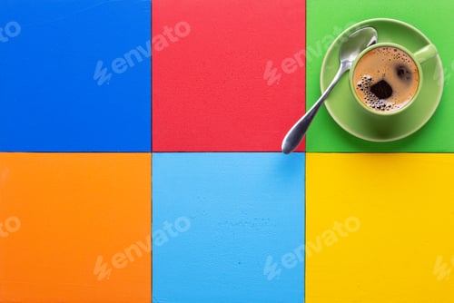 Preview: Cup of coffee and spoon at colorful abstract background