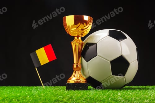 Preview: Soccer trophy and ball showcase with Belgium flag on green grass background