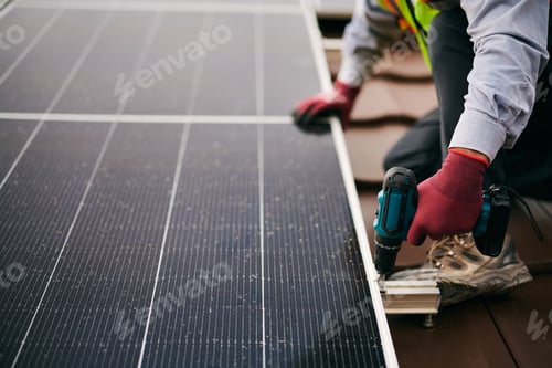 Preview: Close up of solar panel technician working on the rooftop.