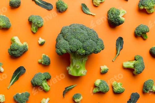 Preview: green fresh broccoli background close up on colored table. Vegetables for diet and healthy eating
