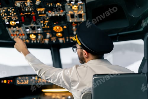 Preview: Airplane cabin The pilot checks the electronics by pressing the buttons Preparing passenger liner