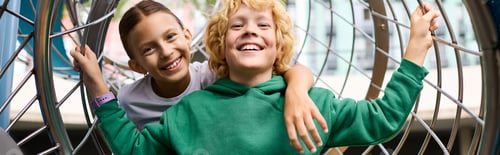 Preview: Joyful childhood friends enjoying autumn playtime in a vibrant park setting