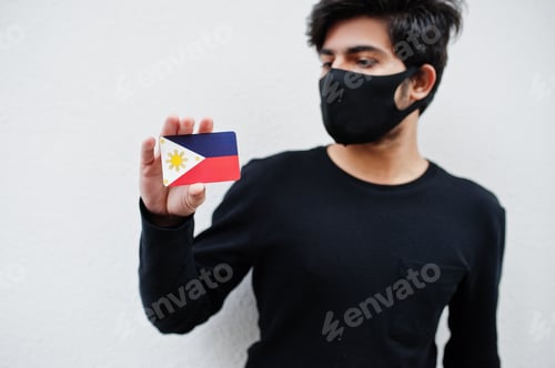Preview: Person Wearing Mask Holding National Symbol Card