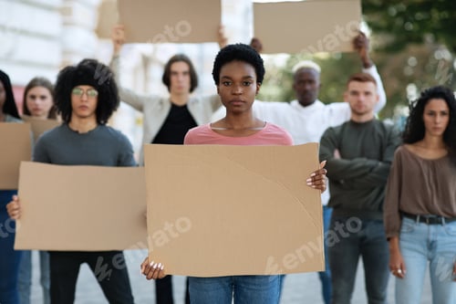 Preview: Black lady leading a group of demonstrators on the street
