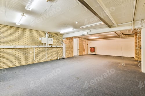 Preview: Empty Room Interior with Brick Walls and Gray Carpet