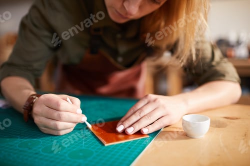 Preview: Woman doing Leatherwork Closeup