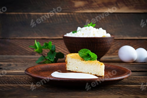 Preview: Homemade cottage cheese casserole on rustic wooden background