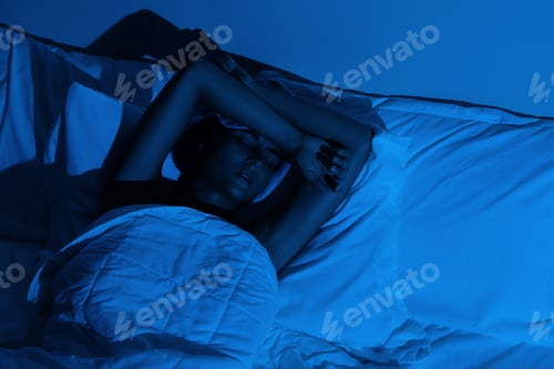 Preview: Young woman with a headache and insomnia