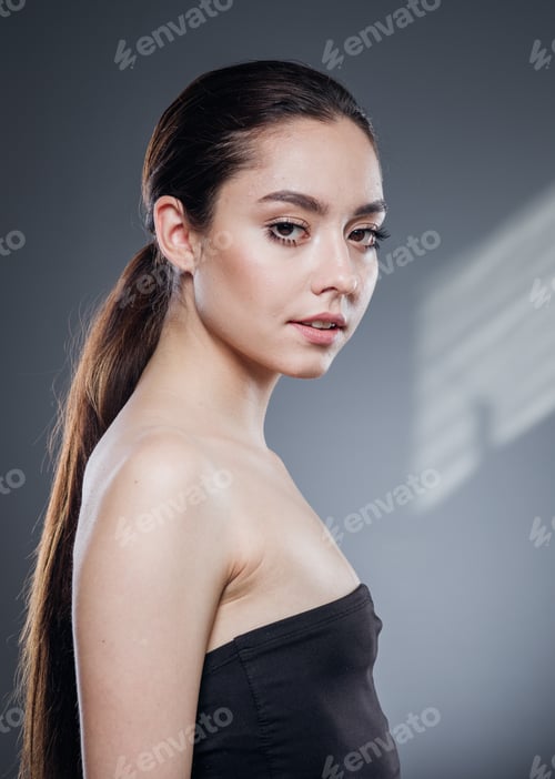 Preview: Portrait of woman with long ponytail and black top