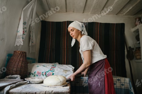Preview: Woman Prepares Dough in Rustic Country Kitchen