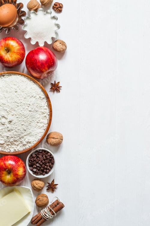 Preview: Ingredients for baking on white wooden background. Selection for apple pie or cupcakes
