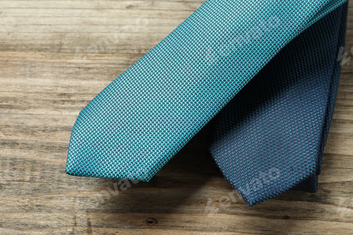 Preview: Two neckties on wooden table, top view