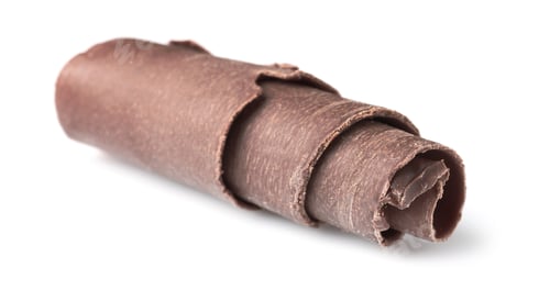 Preview: Curl of tasty chocolate on white background