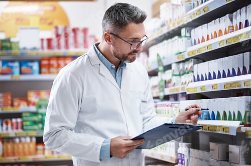 Preview: Medication is his specialty. Shot of a mature pharmacist doing inventory in a pharmacy.