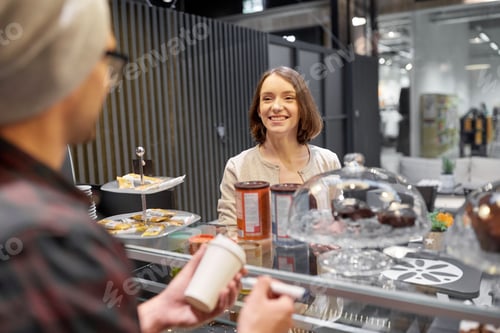 Preview: woman and man or barman with coffee cup at cafe