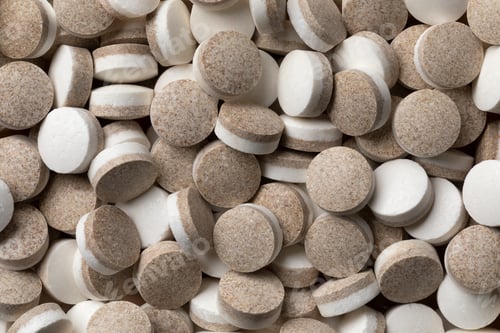 Preview: Dutch black and white liquorice pastilles close up full frame
