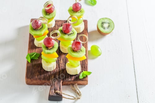 Preview: Colorful Fruit Skewers on a Rustic Wooden Board