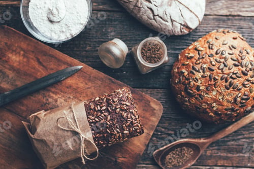 Preview: Delicious fresh bread on wooden background