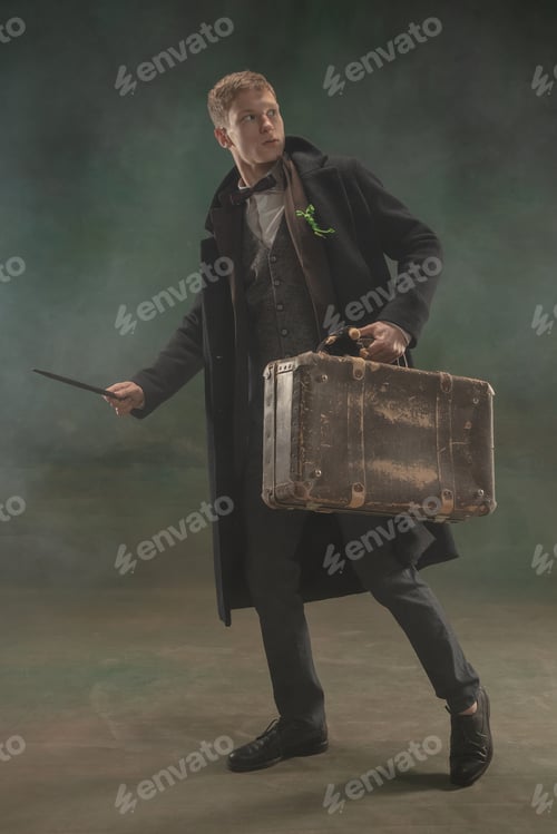 Preview: Young man in art action isolated on dark green background. Retro style, comparison of eras concept