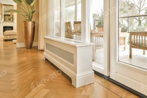 Preview: a living room with a radiator and a wood floor