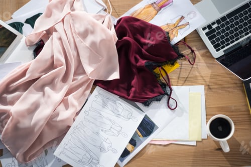 Preview: top view of messy fashion designer workplace