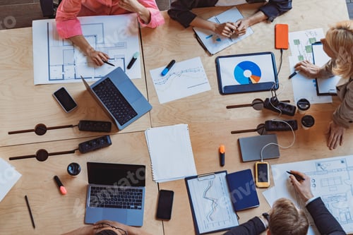 Preview: Top view of business colleagues is discussing project during meeting in modern coworking