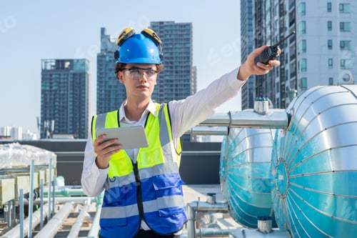 Preview: Engineer under industrial inspection Large water heaters are used in high-rise condominiums.