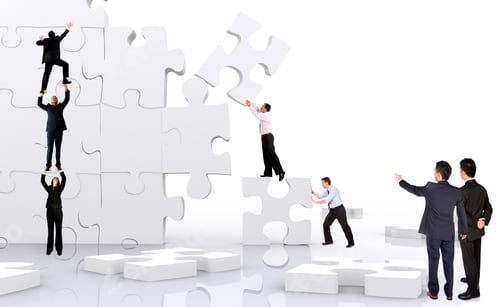 Preview: Business Team Work Building A Puzzle Isolated Over A White Background