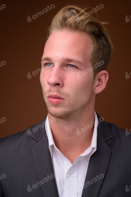 Preview: Studio portrait of young handsome businessman face