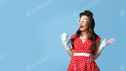 Preview: Unbelievable news. Excited pin up woman in cool retro dress expressing her shock on blue background