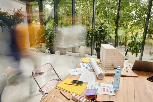 Preview: long exposure of devoted smart coworkers walking in office in blurred motion, startup concept