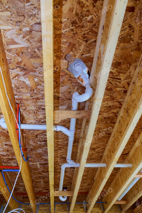 Preview: White PVS pipeline under white ceiling in the new house construction industry pipeline for drainage