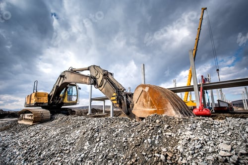 Preview: Heavy duty industrial excavator loading gravel on construction site. Details of building site