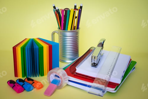 Preview: Group of school supplies and books over a desk, student accessories, teacher's day