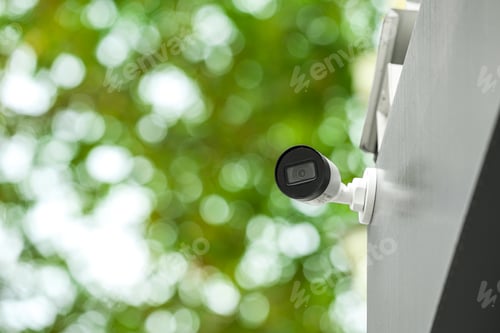 Preview: Modern CCTV security camera on building outdoors. Space for text