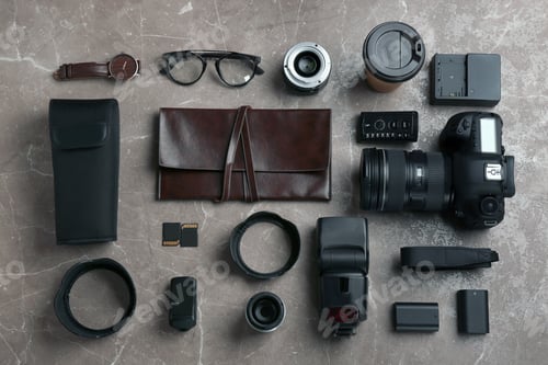 Preview: Flat lay composition with photographer's equipment and accessories on grey background