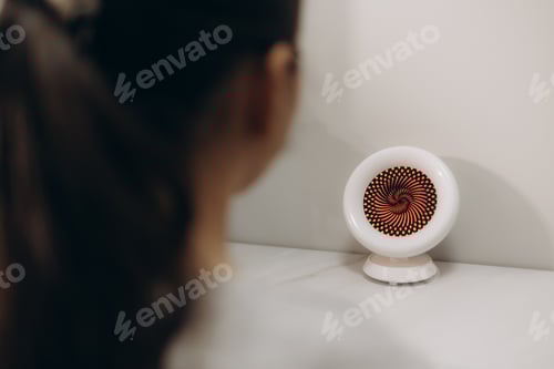 Preview: Doctor testing for eyes with special optical apparatus in modern clinic.