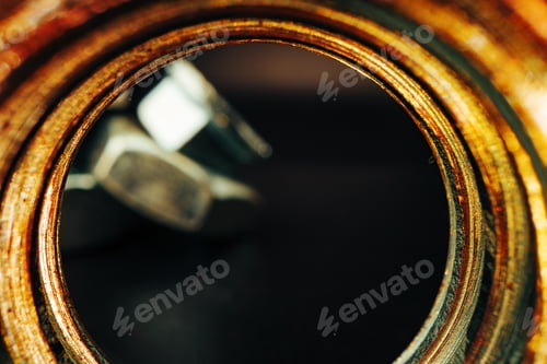 Preview: Metal nut on black background close up