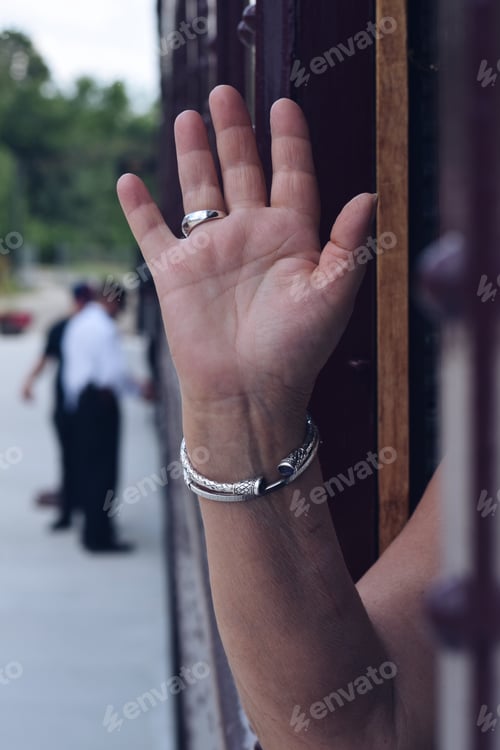 Preview: Woman is waiving goodbye from a train