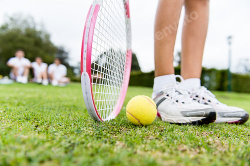 Preview: Tennis Player At The Court With Racket And A Ball