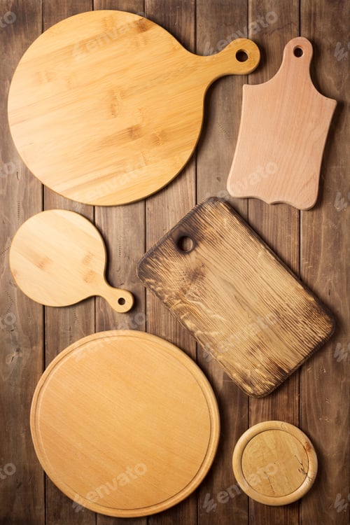 Preview: pizza cutting board at wooden plank board background