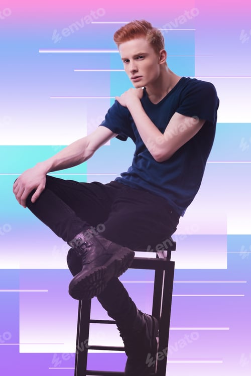 Preview: Mens Power. Doubtful Serious Guy Posing On Chair And Putting Hand On Shoulder