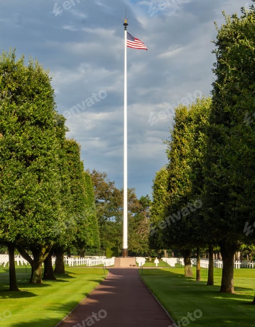 Preview: Serene view of an American cemetery with a flagpole and neatly trimmed trees