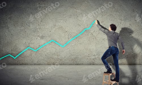 Preview: Young Man Drawing A Financial Graph On The Wall