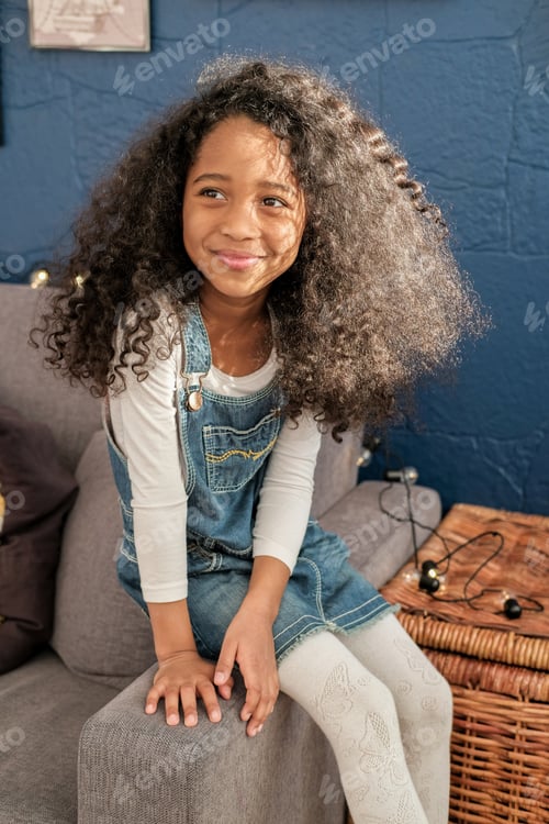 Preview: The African American Child Looks Directly Into The Camera In The Children'S Room.