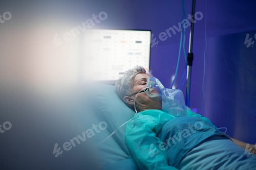 Preview: Infected patient in quarantine lying in bed in hospital, coronavirus concept